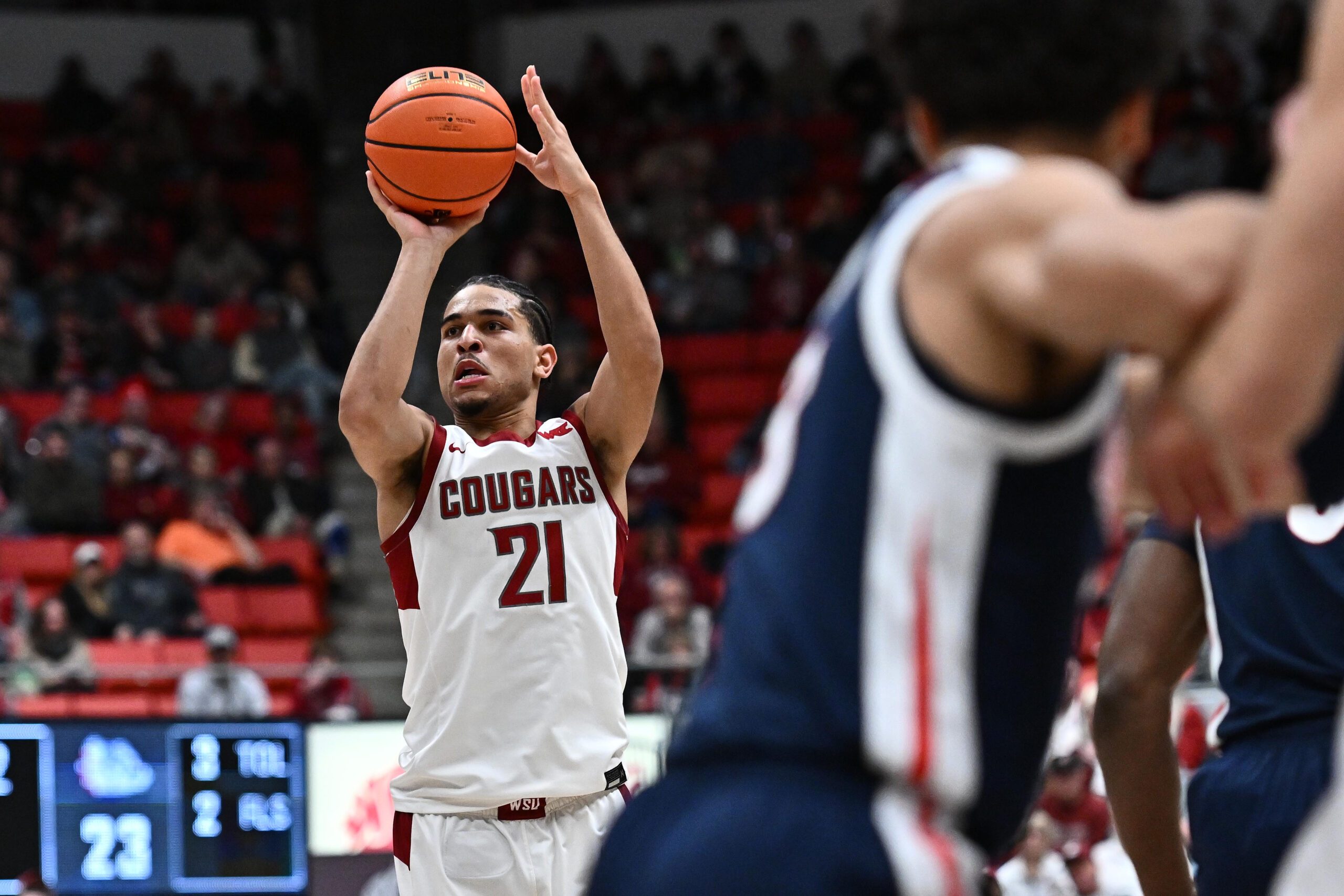 Jan 15, 2026; Pullman, Washington, USA; Washington State Cougars guard Ace Glass Lll (21) shoots a three-point basket against the Gonzaga Bulldogs in the first half at Friel Court at Beasley Coliseum. Mandatory Credit: James Snook-Imagn Images