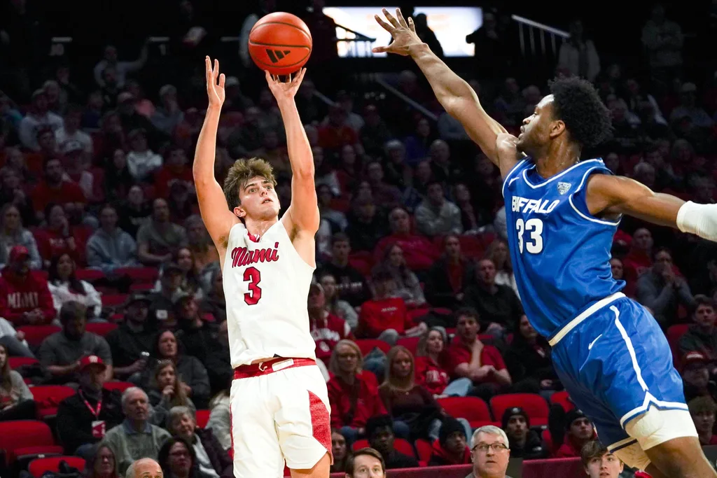 Miami (OH) RedHawks guard Luke Skaljac (3) hits a shot from three point range in the first half of a NCAA men’s basketball game between the Miami RedHawks and Buffalo Bulls, Saturday, Jan. 17, 2026, at Millett Hall in Oxford, Oh.