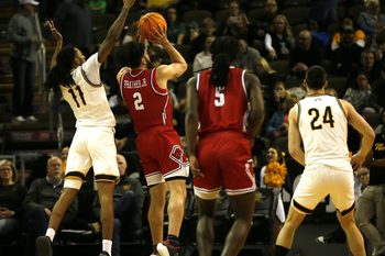 NKU's Tae Dozier (11) tries to block the shot of RMU's Ryan Prather (2) as NKU men's basketball lost 92-89 in overtime to Robert Morris Jan. 17, 2026 at Northern Kentucky University's Truist Arena.