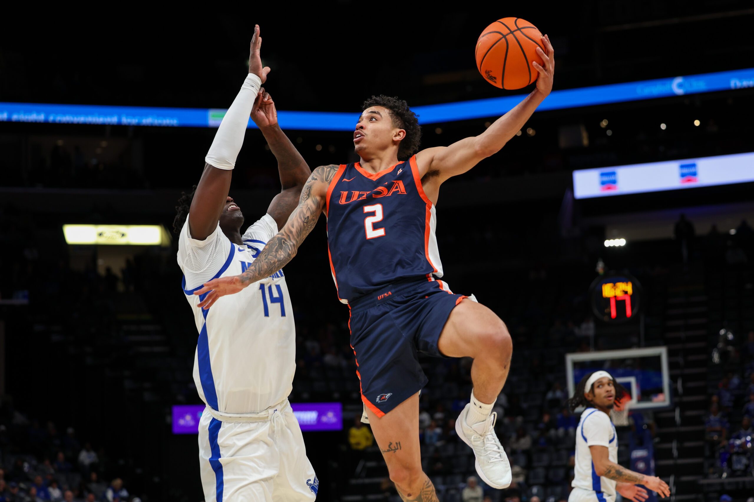 Jan 18, 2026; Memphis, Tennessee, USA; UTSA Roadrunners guard Austin Nunez (2) shoots against Memphis Tigers guard Hasan Abdul Hakim (14) during the second half at FedExForum. Mandatory Credit: Wesley Hale-Imagn Images