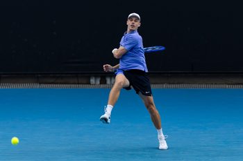 Jan 19, 2026; Melbourne, Victoria, Australia; Denis Shapovalov of Canada in action against Yunchaokete Bu of China in the first round of the men’s singles at the Australian Open at ANZ Arena in Melbourne Park. Mandatory Credit: Mike Frey-Imagn Images