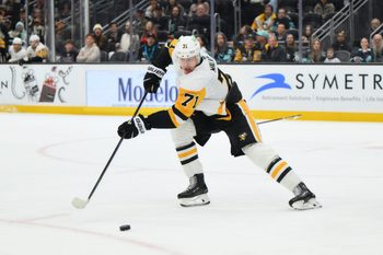 Jan 19, 2026; Seattle, Washington, USA; Pittsburgh Penguins center Evgeni Malkin (71) passes the puck against the Seattle Kraken during the second period at Climate Pledge Arena. Mandatory Credit: Steven Bisig-Imagn Images