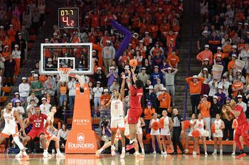 NC State Wolfpack forward Darrion Williams (1) shoots the ball past Clemson Tigers forward RJ Godfrey (0) with seven seconds left in the second half on Tuesday, Jan. 20, 2026, during the NCAA men’s basketball game at Littlejohn Coliseum in Clemson, South Carolina. NC State Wolfpack won 80-76 in OT.