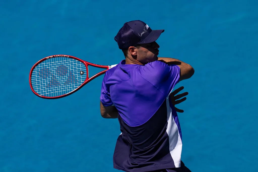 Jan 25, 2026; Melbourne, Victoria, Australia; Tommy Paul of United States in action against Carlos Alcaraz of Spain in the fourth round of the menís singles at the Australian Open at Rod Laver Arena in Melbourne Park. Mandatory Credit: Mike Frey-Imagn Images