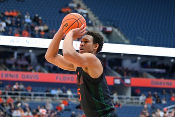 Jan 24, 2026; Syracuse, New York, USA; Miami Hurricanes forward Malik Reneau (5) shoots during the first half against the Syracuse Orange at the JMA Wireless Dome. Mandatory Credit: Rich Barnes-Imagn Images