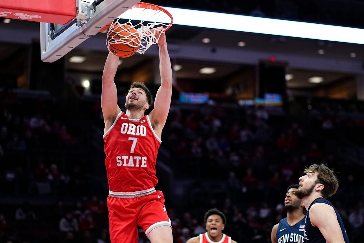 Ohio State Buckeyes center Ivan Njegovan (7) dunks over Penn State Nittany Lions forward Ivan Juric (3) during the second half of the NCAA men's basketball game at the Schottenstein Center in Columbus on Jan. 26, 2026. Ohio State won 84-78.