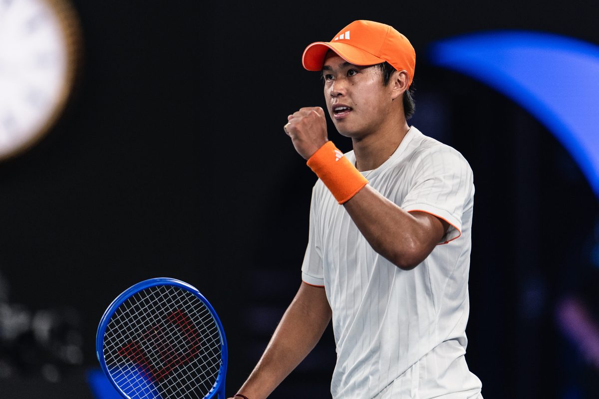 Jan 27, 2026; Melbourne, Victoria, Australia; Learner Tien of United States in action against Alexander Zverev of Germany in the quarterfinals of the menís singles at the Australian Open at Rod Laver Arena in Melbourne Park. Mandatory Credit: Mike Frey-Imagn Images