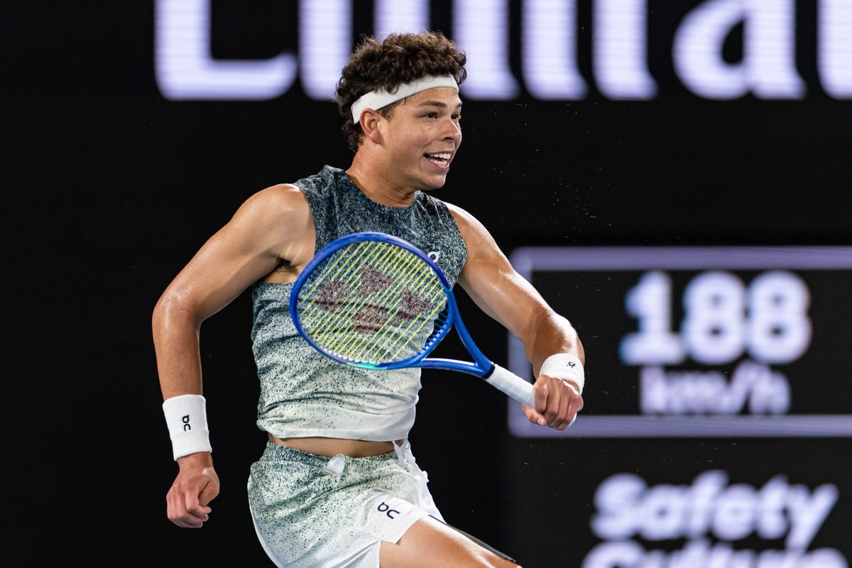 Jan 28, 2026; Melbourne, Victoria, Australia; Ben Shelton of United States in action against Jannik Sinner of Italy in the quarterfinals of the menís singles at the Australian Open at Rod Laver Arena in Melbourne Park. Mandatory Credit: Mike Frey-Imagn Images