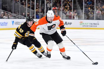 Jan 29, 2026; Boston, Massachusetts, USA; Philadelphia Flyers defenseman Jamie Drysdale (9) controls the puck from Boston Bruins center Fraser Minten (93) during the second period at TD Garden. Mandatory Credit: Bob DeChiara-Imagn Images