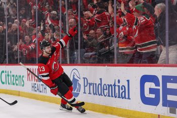 Jan 29, 2026; Newark, New Jersey, USA; New Jersey Devils center Nico Hischier (13) celebrates his overtime game winning goal against the Nashville Predators at Prudential Center. Mandatory Credit: Ed Mulholland-Imagn Images