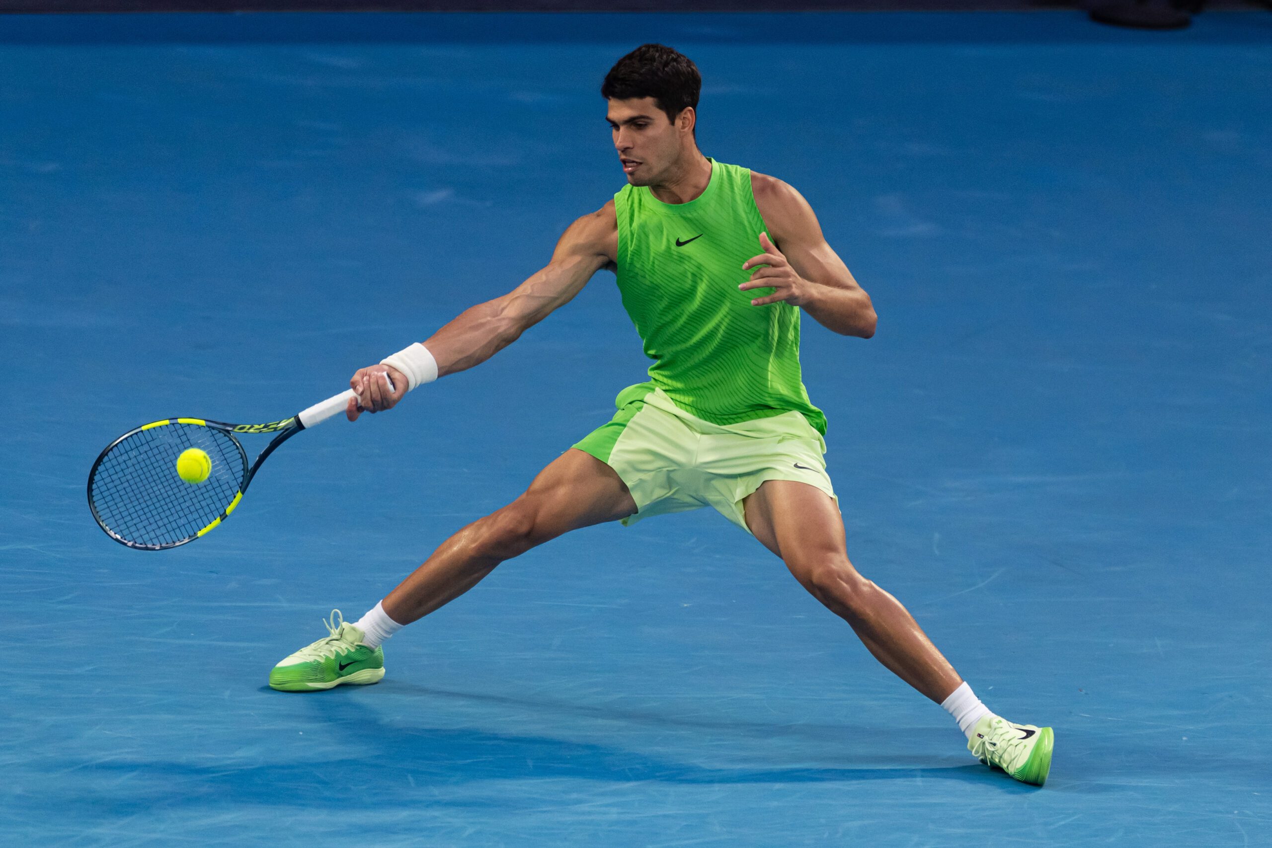 Jan 30, 2026; Melbourne, Victoria, Australia; Carlos Alcaraz of Spain in action against Alexander Zverev of Germany in the semifinals of the menís singles at the Australian Open at Rod Laver Arena in Melbourne Park. Mandatory Credit: Mike Frey-Imagn Images