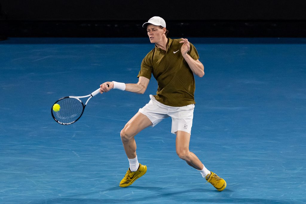 Jan 30, 2026; Melbourne, Victoria, Australia; Jannik Sinner of Italy in action against Novak Djokovic of Serbia in the semifinals of the menís singles at the Australian Open at Rod Laver Arena in Melbourne Park. Mandatory Credit: Mike Frey-Imagn Images