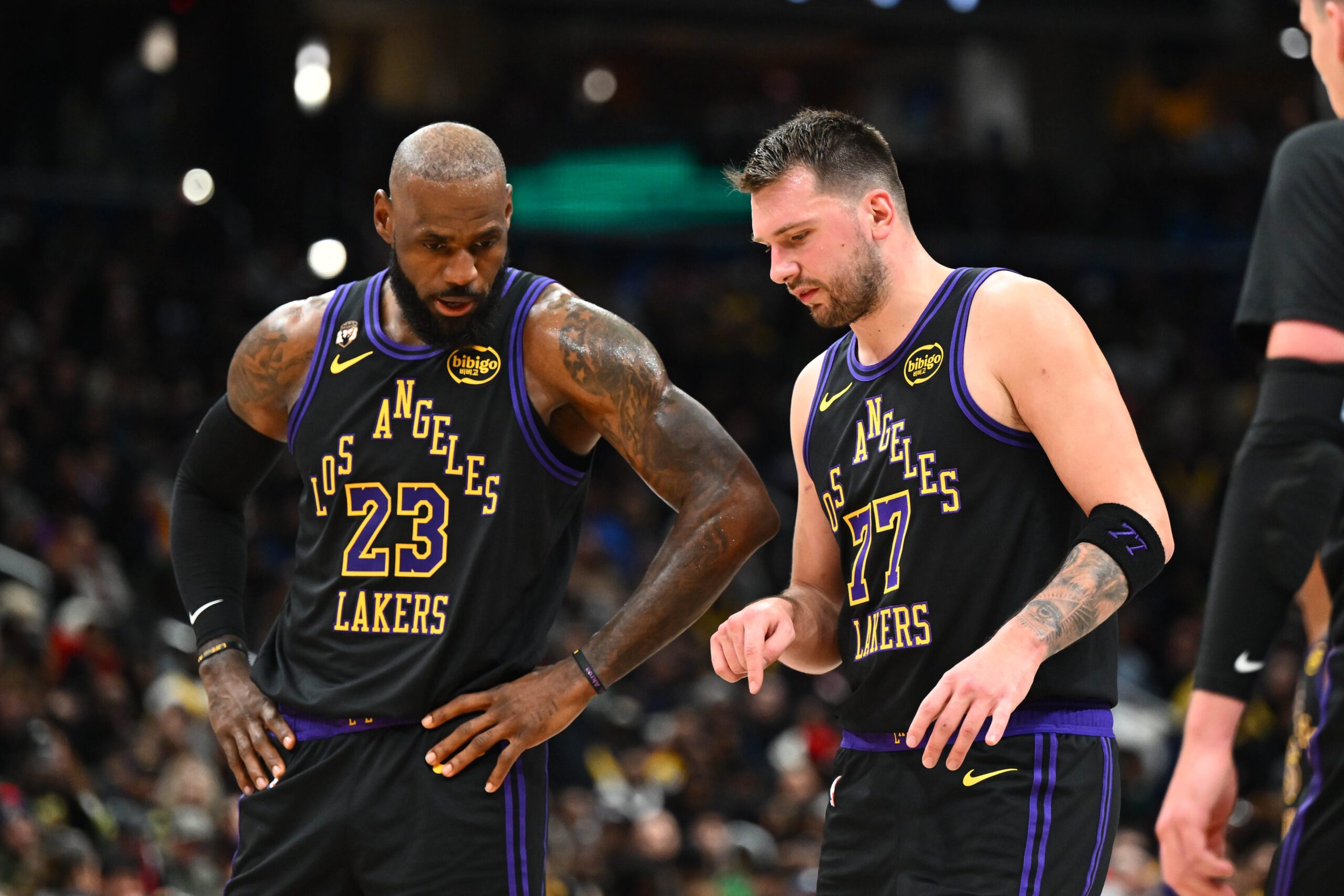 Jan 30, 2026; Washington, District of Columbia, USA; Los Angeles Lakers forward/guard Luka Doncic (77) talks with Los Angeles Lakers forward LeBron James (23) against the Washington Wizards during the second half at Capital One Arena. Mandatory Credit: Brad Mills-Imagn Images
