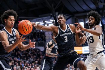 Georgetown Hoyas forward Isaiah Abraham (7), Georgetown Hoyas center Vincent Iwuchukwu (3) and Butler Bulldogs center Drayton Jones (13) reach for the ball Saturday, Jan. 31, 2026, during a basketball game between the Butler Bulldogs and the Georgetown Hoyas at Hinkle Fieldhouse in Indianapolis.