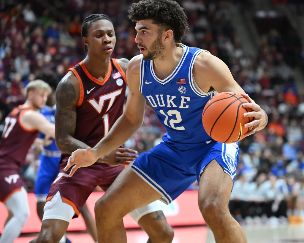 Jan 31, 2026; Blacksburg, Virginia, USA; Duke Blue Devils forward Cameron Boozer (12) works against Virginia Tech Hokies forward Tobi Lawal (1) during the first half at Cassell Coliseum. Mandatory Credit: Brian Bishop-Imagn Images