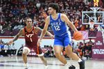 Jan 31, 2026; Blacksburg, Virginia, USA;  Duke Blue Devils forward Cameron Boozer (12) controls the ball as Virginia Tech Hokies forward Tobi Lawal (1) defends during the first half at Cassell Coliseum. Mandatory Credit: Brian Bishop-Imagn Images