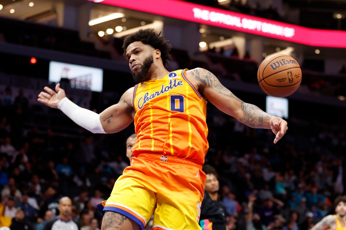 Jan 31, 2026; Charlotte, North Carolina, USA; Charlotte Hornets forward Miles Bridges (0) follows through on a slam dunk against the San Antonio Spurs during second half action at Spectrum Center. Mandatory Credit: Brian Westerholt-Imagn Images