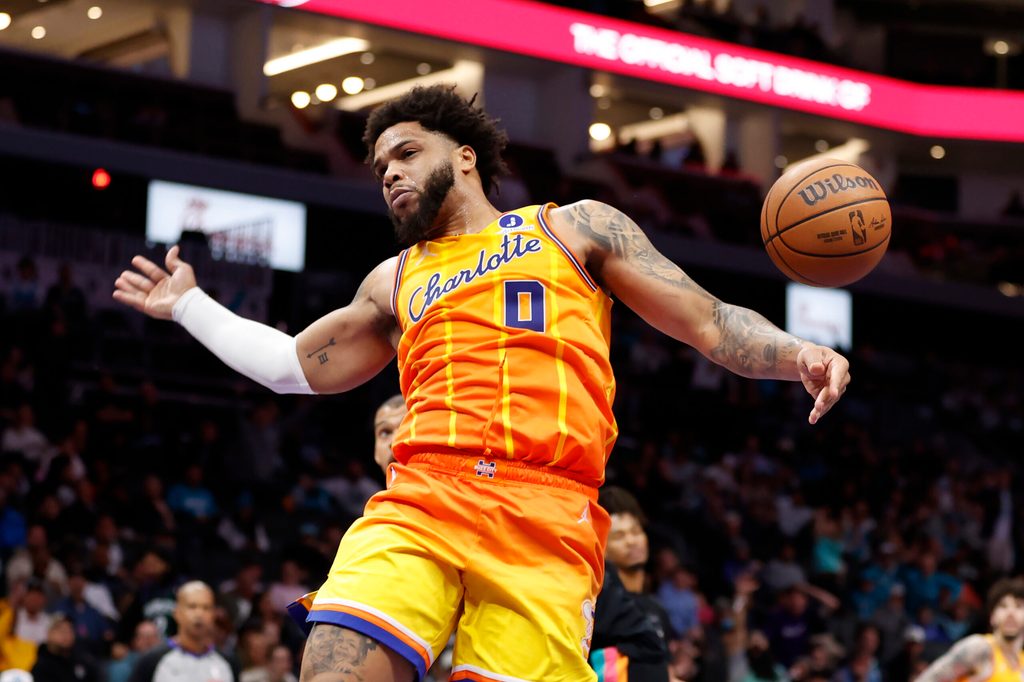Jan 31, 2026; Charlotte, North Carolina, USA; Charlotte Hornets forward Miles Bridges (0) follows through on a slam dunk against the San Antonio Spurs during second half action at Spectrum Center. Mandatory Credit: Brian Westerholt-Imagn Images