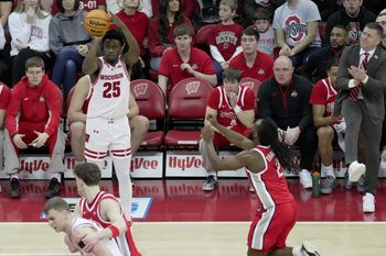 Wisconsin guard John Blackwell (25) hits a three-point basket as Ohio State head coach Jake Diebler looks on during the first half of their game Saturday, January 31, 2026 at the Kohl Center in Madison, Wisconsin.