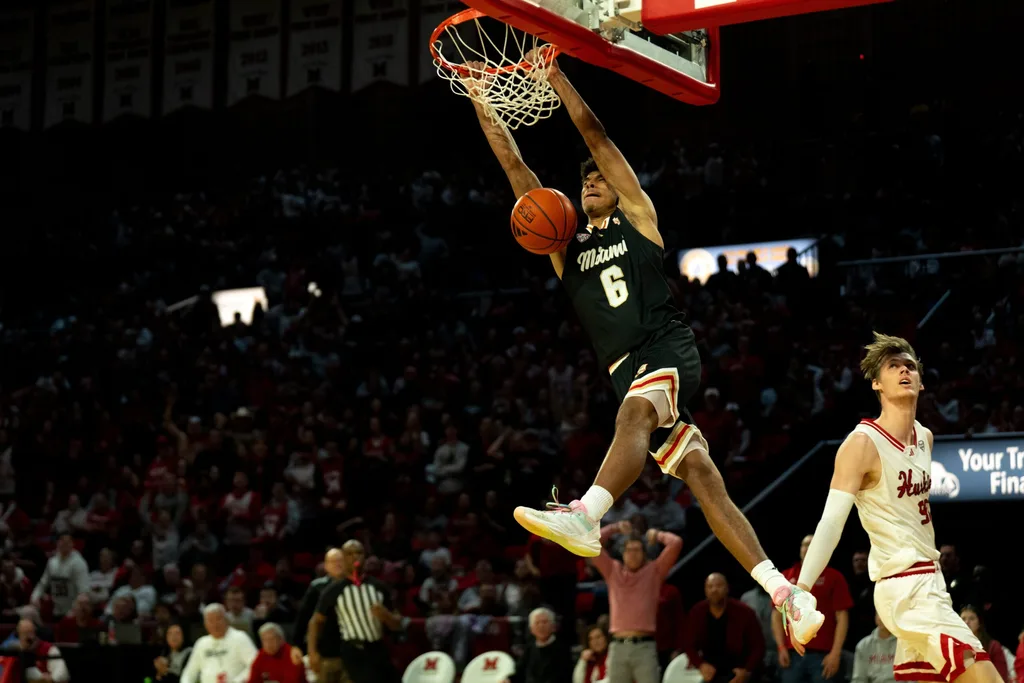 Miami RedHawks guard Justin Kirby (6) dunks on Northern Illinois Huskies forward Gustav Winther (96) defends in the second half of the NCAA Basketball game at Millett Hall in Oxford, Ohio, on Saturday, January 31, 2026.