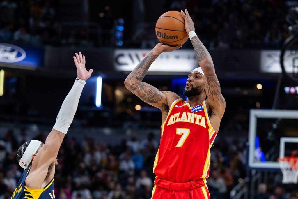 Jan 31, 2026; Indianapolis, Indiana, USA; Atlanta Hawks guard Nickeil Alexander-Walker (7) shoots the ball while Indiana Pacers guard/forward Andrew Nembhard (2) defends in the second half at Gainbridge Fieldhouse. Mandatory Credit: Trevor Ruszkowski-Imagn Images