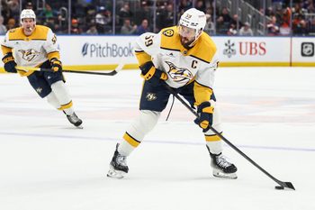Jan 31, 2026; Elmont, New York, USA;  Nashville Predators defenseman Roman Josi (59) attempts a shot on goal in the third period against the New York Islanders at UBS Arena. Mandatory Credit: Wendell Cruz-Imagn Images