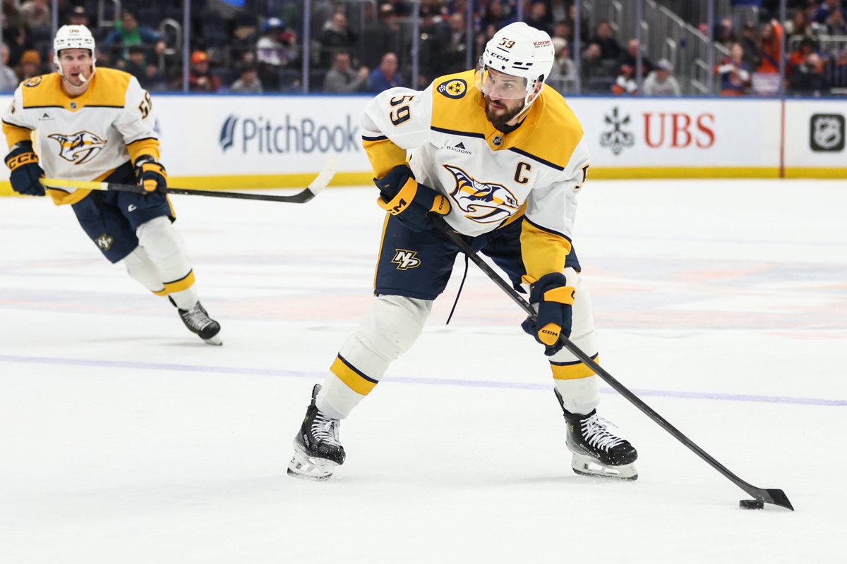 Jan 31, 2026; Elmont, New York, USA; Nashville Predators defenseman Roman Josi (59) attempts a shot on goal in the third period against the New York Islanders at UBS Arena. Mandatory Credit: Wendell Cruz-Imagn Images