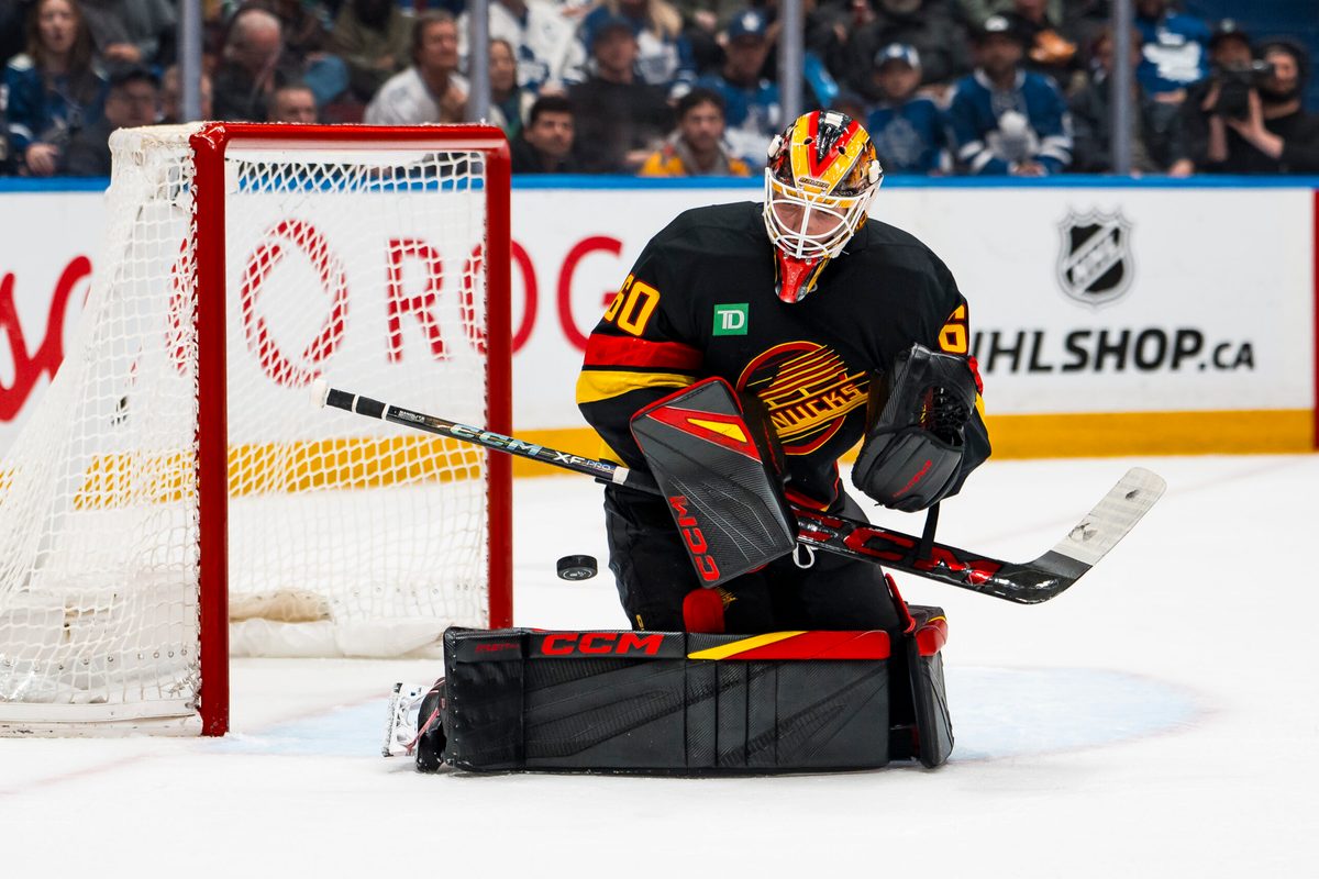 Jan 31, 2026; Vancouver, British Columbia, CAN; Vancouver Canucks goalie Nikita Tolopilo (60) makes a save against the Toronto Maple Leafs in the third period at Rogers Arena. Mandatory Credit: Bob Frid-Imagn Images