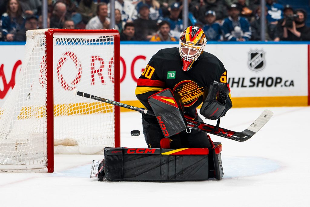 Jan 31, 2026; Vancouver, British Columbia, CAN; Vancouver Canucks goalie Nikita Tolopilo (60) makes a save against the Toronto Maple Leafs in the third period at Rogers Arena. Mandatory Credit: Bob Frid-Imagn Images