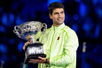 Jan 31, 2026; Melbourne, Victoria, Australia; Carlos Alcaraz of Spain with the Norman Brookes Challenge Cup after his victory over Novak Djokovic of Serbia in the final of the menís singles at the Australian Open at Rod Laver Arena in Melbourne Park. Mandatory Credit: Mike Frey-Imagn Images