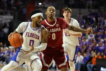Florida guard Boogie Fland (0) drives against Alabama guard Labaron Philon (0) during the second half of an NCAA Mens basketball game at Steven C. O'Connell Center Exactek arena in Gainesville, FL on Sunday, February 1, 2026. Florida beat Alabama 100-77. [Alan Youngblood/Gainesville Sun]
