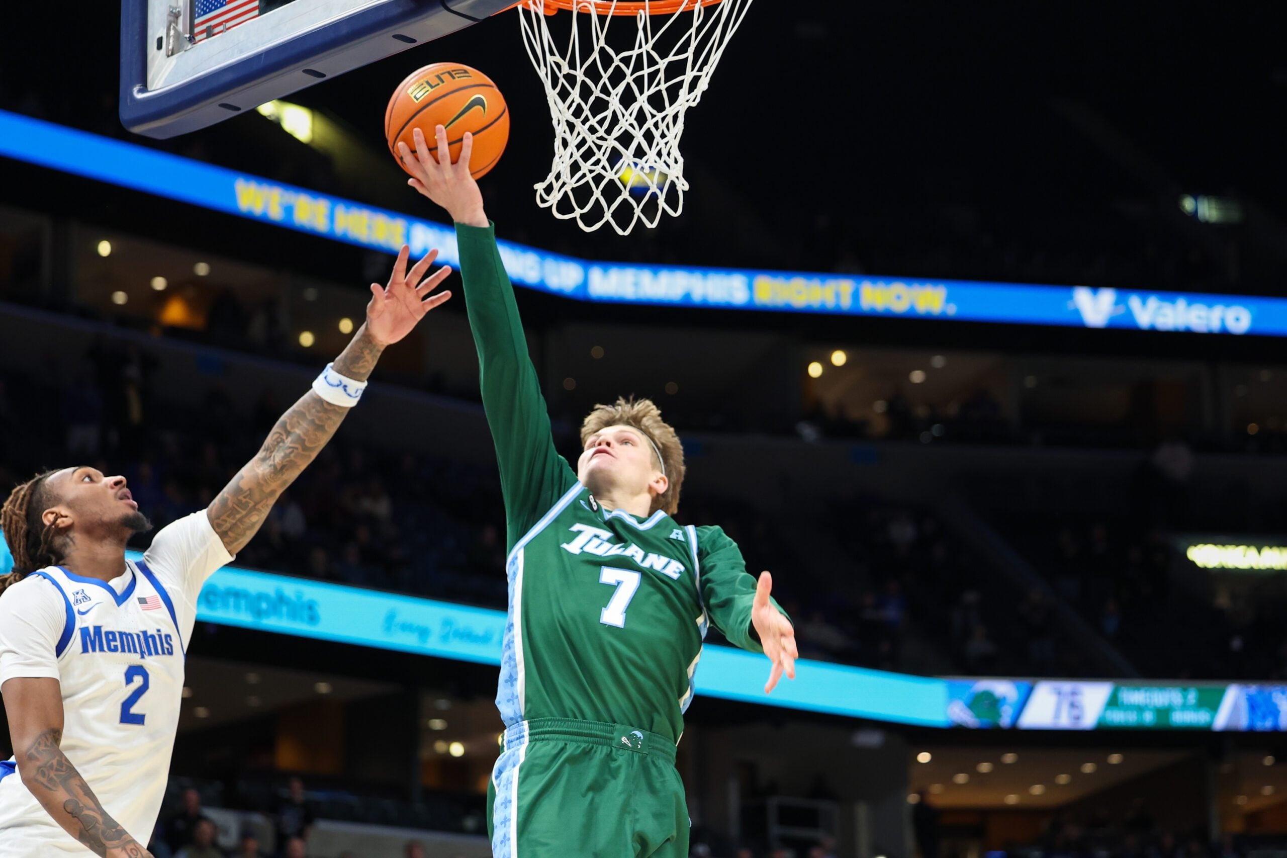 Feb 1, 2026; Memphis, Tennessee, USA; Tulane Green Wave guard Rowan Brumbaugh (7) makes the winning layup with seconds remaining in the second half against the Memphis Tigers at FedExForum. Mandatory Credit: Wesley Hale-Imagn Images