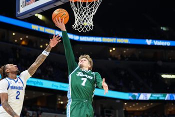 Feb 1, 2026; Memphis, Tennessee, USA; Tulane Green Wave guard Rowan Brumbaugh (7) makes the winning layup with seconds remaining in the second half against the Memphis Tigers at FedExForum. Mandatory Credit: Wesley Hale-Imagn Images