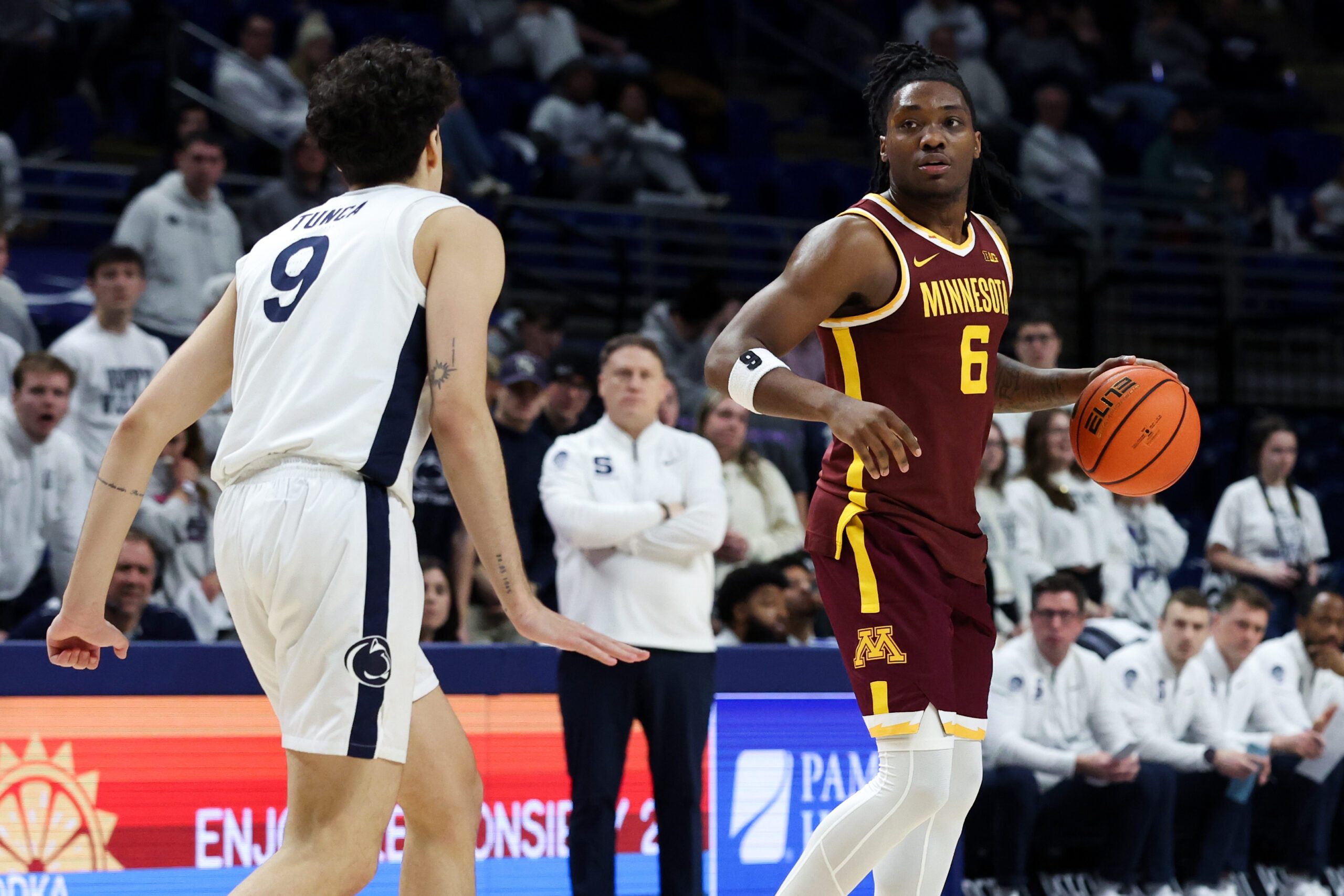 Feb 1, 2026; University Park, Pennsylvania, USA; Minnesota Golden Gophers guard Langston Reynolds (6) dribbles the ball as Penn State Nittany Lions guard Melih Tunca (9) defends during the second half at Bryce Jordan Center. Mandatory Credit: Matthew O'Haren-Imagn Images