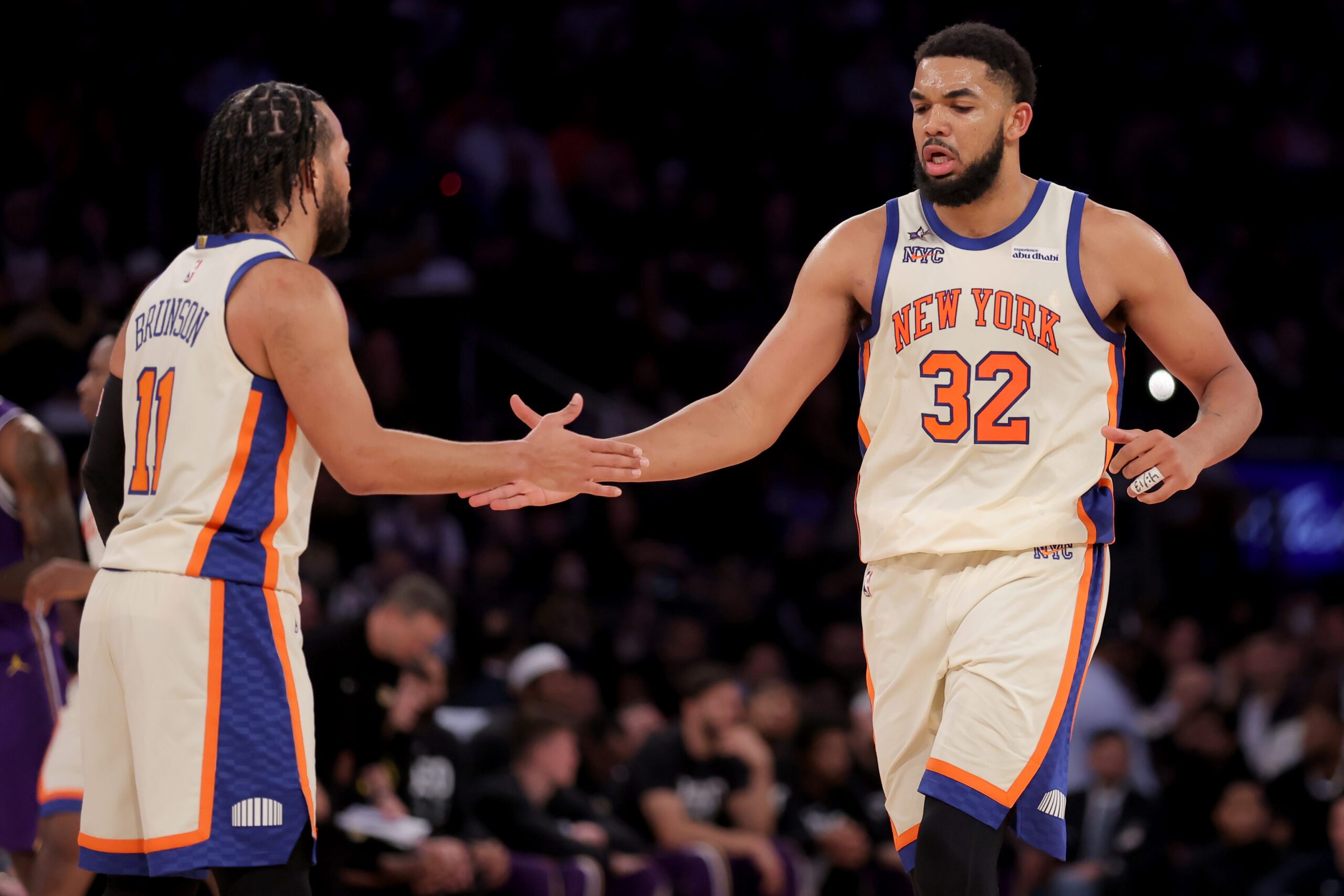 Feb 1, 2026; New York, New York, USA; New York Knicks center Karl-Anthony Towns (32) high fives guard Jalen Brunson (11) during the third quarter against the Los Angeles Lakers at Madison Square Garden. Mandatory Credit: Brad Penner-Imagn Images