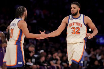 Feb 1, 2026; New York, New York, USA; New York Knicks center Karl-Anthony Towns (32) high fives guard Jalen Brunson (11) during the third quarter against the Los Angeles Lakers at Madison Square Garden. Mandatory Credit: Brad Penner-Imagn Images