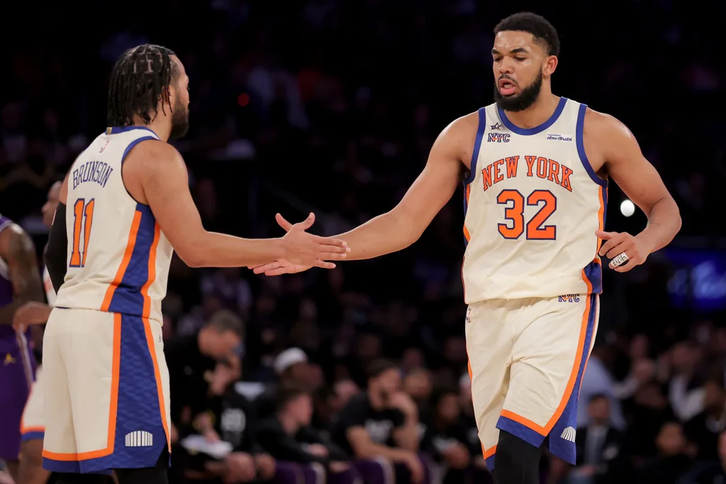 Feb 1, 2026; New York, New York, USA; New York Knicks center Karl-Anthony Towns (32) high fives guard Jalen Brunson (11) during the third quarter against the Los Angeles Lakers at Madison Square Garden. Mandatory Credit: Brad Penner-Imagn Images