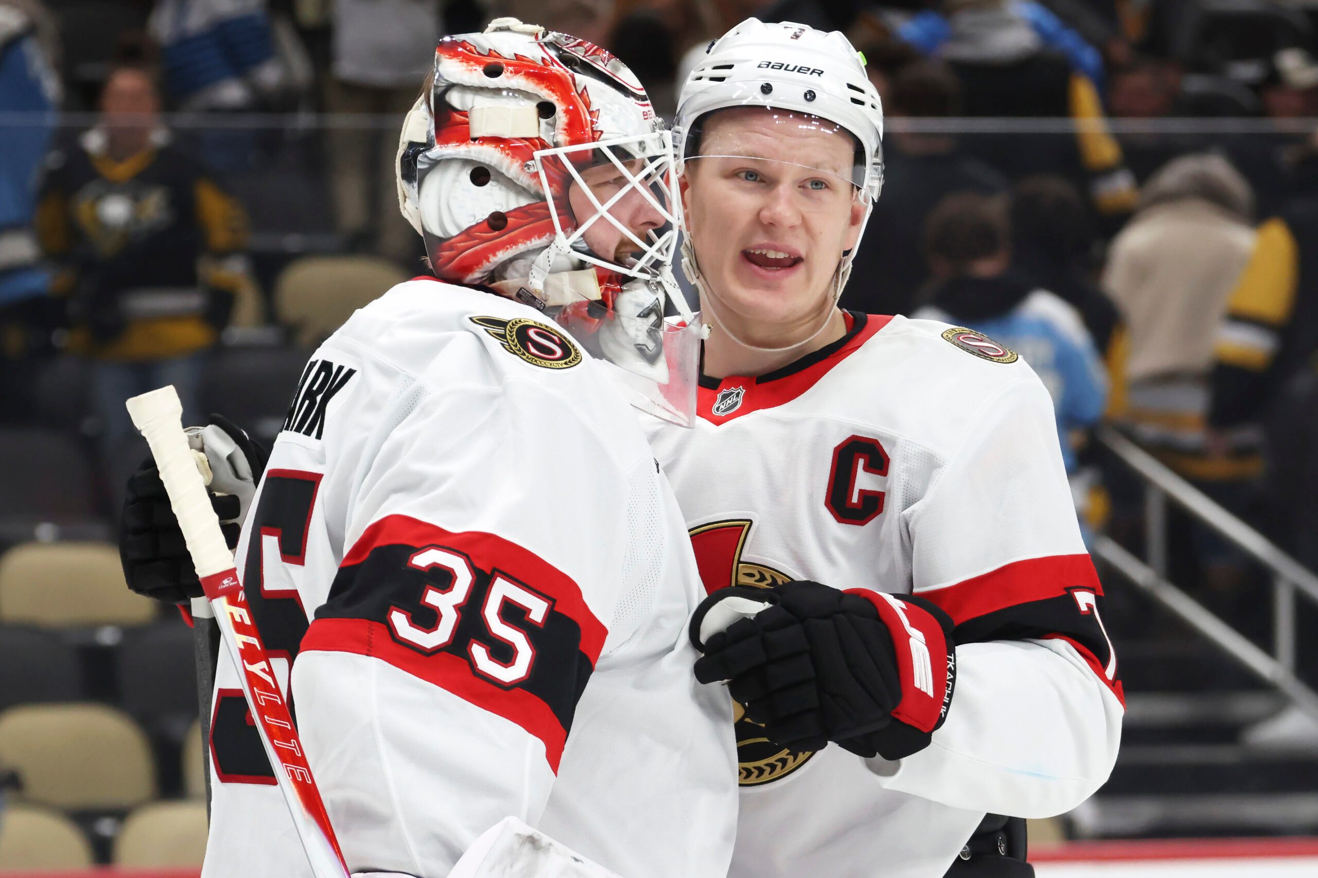 Feb 2, 2026; Pittsburgh, Pennsylvania, USA;  Ottawa Senators goaltender Linus Ullmark (35) and left wing Brady Tkachuk (7) celebrate a victory over the Pittsburgh Penguins at PPG Paints Arena. Mandatory Credit: Charles LeClaire-Imagn Images