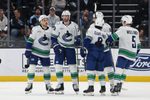 Feb 2, 2026; Salt Lake City, Utah, USA; The Vancouver Canucks celebrate a goal against the Utah Mammoth by Vancouver Canucks center Teddy Blueger (53) during the second period at Delta Center. Mandatory Credit: Rob Gray-Imagn Images