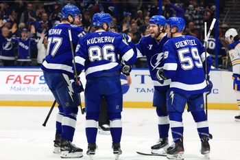 Feb 3, 2026; Tampa, Florida, USA; Tampa Bay Lightning right wing Nikita Kucherov (86) is congratulated by left wing Brandon Hagel (38), defenseman Victor Hedman (77) and center Jake Guentzel (59)  after he scored a goal against the Buffalo Sabres during the first period at Benchmark International Arena. Mandatory Credit: Kim Klement Neitzel-Imagn Images