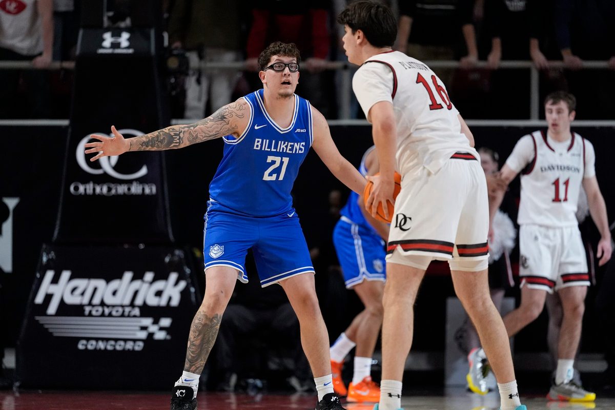 Feb 3, 2026; Davidson, North Carolina, USA; Davidson Wildcats forward Ian Platteeuw (16) sets the play defended by Saint Louis Billikens center Robbie Avila (21) during the first half at McKillop Court at John M. Belk Arena. Mandatory Credit: Jim Dedmon-Imagn Images