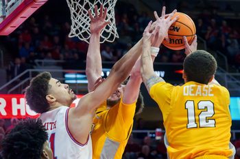 Bradley’s AJ Smith, left, battles for a rebound with Valparaiso’s Owen Dease, right, and Brody Whitaker in the first half of their college basketball game Tuesday, Feb. 3, 2026 at the Peoria Civic Center. The Braves defeated the Beacons 72-65.