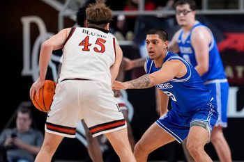 Feb 3, 2026; Davidson, North Carolina, USA; Saint Louis Billikens forward Ishan Sharma (9) on defense against Davidson Wildcats guard Roberts Blums (45) during the second half at McKillop Court at John M. Belk Arena. Mandatory Credit: Jim Dedmon-Imagn Images