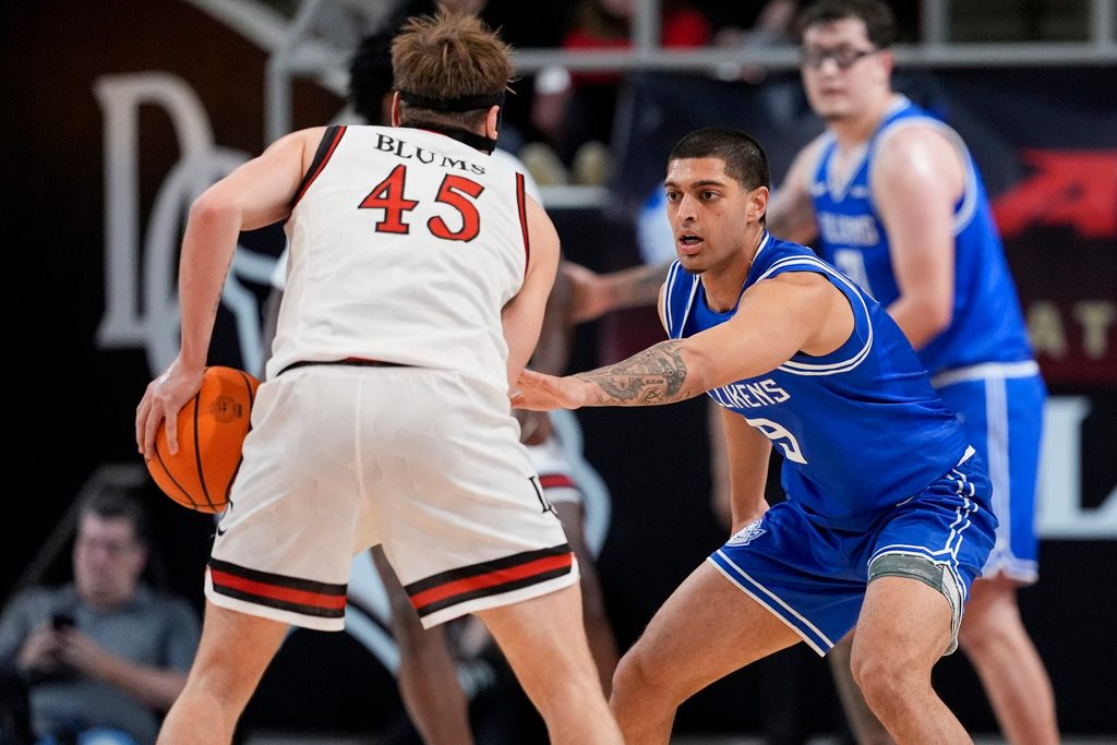 Feb 3, 2026; Davidson, North Carolina, USA; Saint Louis Billikens forward Ishan Sharma (9) on defense against Davidson Wildcats guard Roberts Blums (45) during the second half at McKillop Court at John M. Belk Arena. Mandatory Credit: Jim Dedmon-Imagn Images