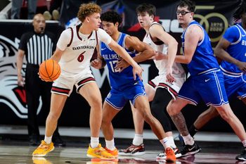 Feb 3, 2026; Davidson, North Carolina, USA; Davidson Wildcats guard Devin Brown (6) handles the ball against Saint Louis Billikens guard Dion Brown (13) during the second half at McKillop Court at John M. Belk Arena. Mandatory Credit: Jim Dedmon-Imagn Images