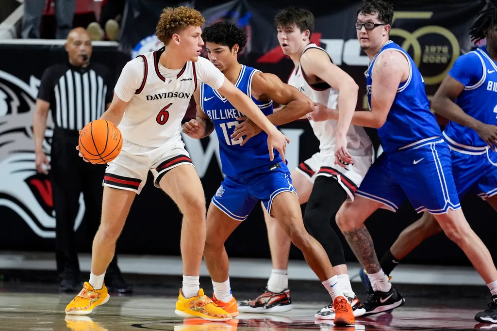Feb 3, 2026; Davidson, North Carolina, USA; Davidson Wildcats guard Devin Brown (6) handles the ball against Saint Louis Billikens guard Dion Brown (13) during the second half at McKillop Court at John M. Belk Arena. Mandatory Credit: Jim Dedmon-Imagn Images