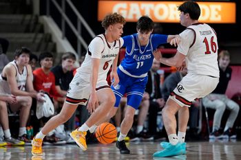 Feb 3, 2026; Davidson, North Carolina, USA; Davidson Wildcats guard Devin Brown (6) handles the ball defended by Saint Louis Billikens forward Brady Dunlap (11) during the second half at McKillop Court at John M. Belk Arena. Mandatory Credit: Jim Dedmon-Imagn Images