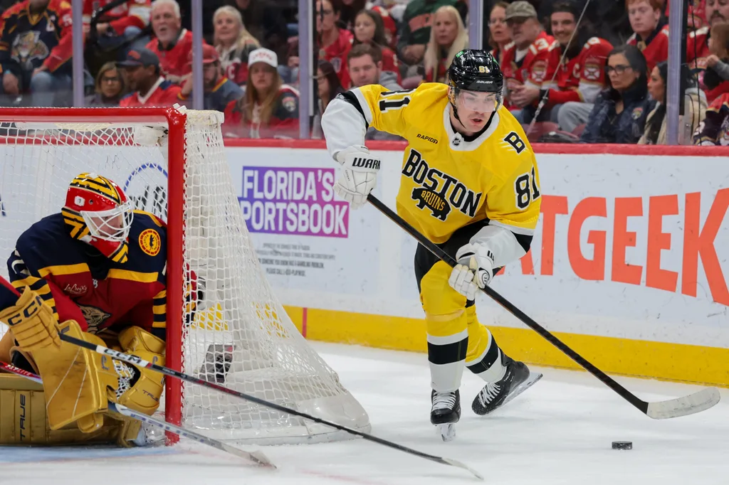 Feb 4, 2026; Sunrise, Florida, USA; Boston Bruins center Michael Eyssimont (81) moves the puck behind the net of Florida Panthers goaltender Sergei Bobrovsky (72) during the second period at Amerant Bank Arena. Mandatory Credit: Sam Navarro-Imagn Images