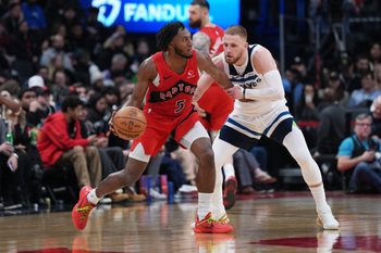 Feb 4, 2026; Toronto, Ontario, CAN; Toronto Raptors guard Immanuel Quickley (5) dribbles against Minnesota Timberwolves guard Donte DiVincenzo (0) during the fourth quarter at Scotiabank Arena. Mandatory Credit: Nick Turchiaro-Imagn Images