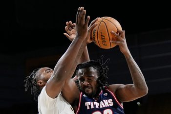 Milwaukee Panthers guard Aaron Franklin (29) attempts to block Detroit Mercy Titans forward London Maiden (20) during the first half of the game on Wednesday February 4, 2026 at the UW-Milwaukee Panther Arena in Milwaukee, Wisconsin.
